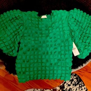 Green textured top.